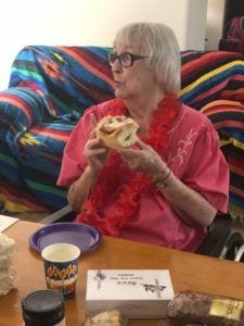 Grandma eating a Kneaders cinnamon roll